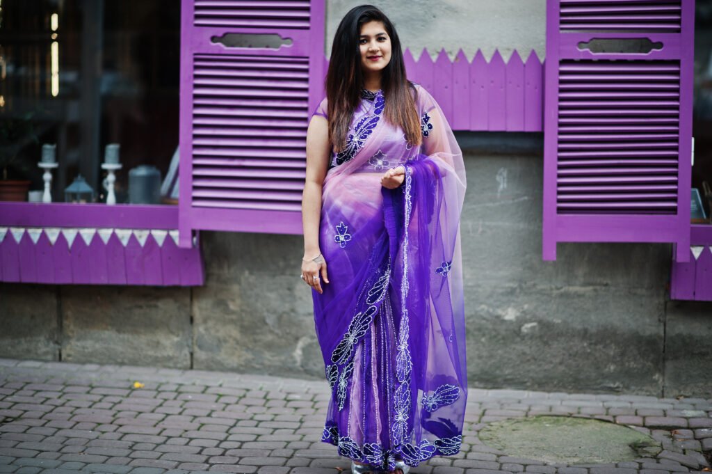 indian hindu girl at traditional violet saree posed at street ag