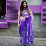 indian hindu girl at traditional violet saree posed at street ag
